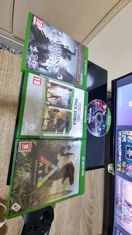 Xbox One game bundle: Assassin's Creed, ARK Survival + others (3 discs + case)