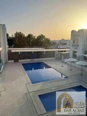 Luxury three-bedroom apartment with a master bedroom, living room, and ensuite maid's room with lau