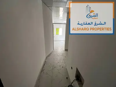 Studio in Al Mowaihat 2, separate kitchen, spacious area, new split AC near Shorooq Mall.