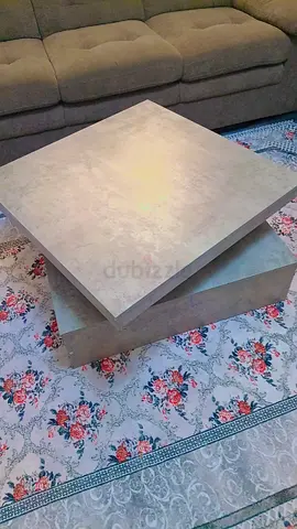 Modern square rotating coffee table in light wood finish