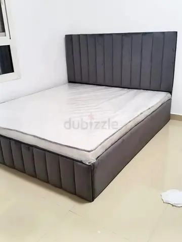 Grey Upholstered Double Bed with Headboard and Storage Base