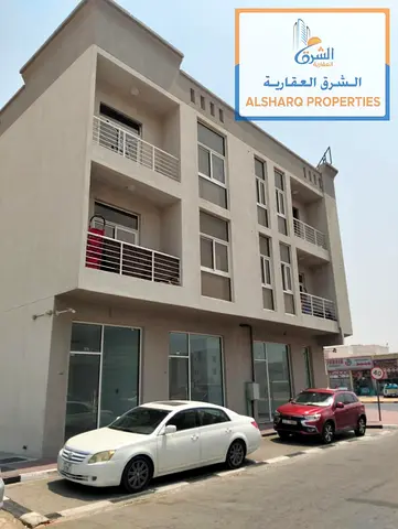 Mixed-Use Building for Sale in Al Zahya Ajman for AED 4M, 8 Apartments, 6 Shops, Main Road & Projected Income of AED 370K