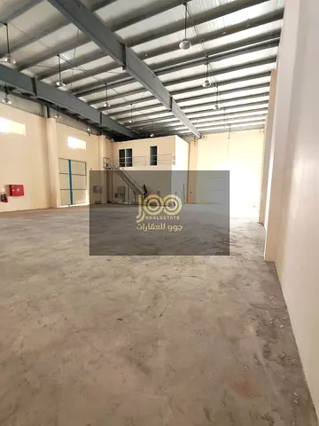 The warehouse features a mezzanine office level, providing additional space suitable for management and administrative offices.
