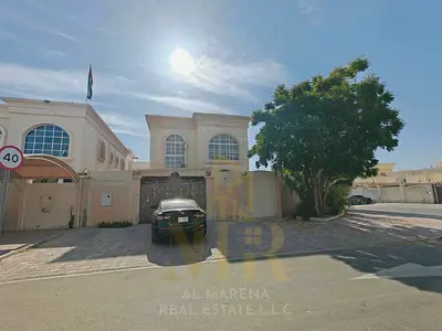 Corner villa for sale in Al Rawda 3 area, price includes electricity, water, and air conditioning.