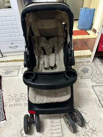 Well-kept standard baby stroller with snack tray and reclining seat