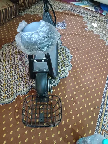 Brand new electric scooter with rear basket and seat - clean condition