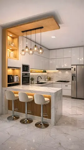 Modern white marble kitchen island with pendant lighting and breakfast bar