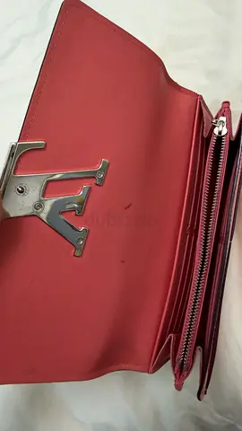 Pre-owned red women's wallet with metal logo clasp - good condition