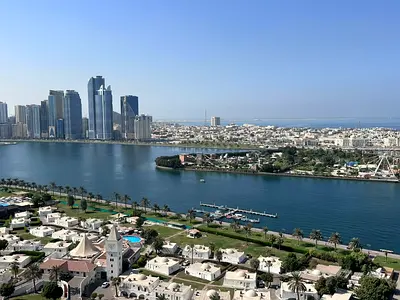 🏡 **For Sale – Luxury Duplex Apartment** 🌊 Unobstructed and stunning views of Khalid Lagoon 📐 Size: Approximately **4,375 sq ft** 🚗 Two parking -