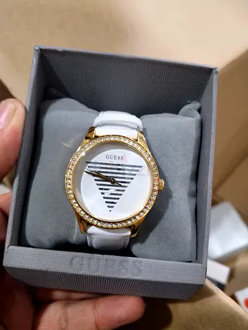 Guess women's gold-tone watch with white leather strap, crystal bezel