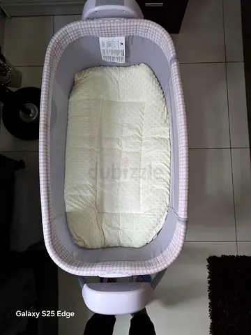 Used portable baby electrical bassinet/crib - light pink check, good condition