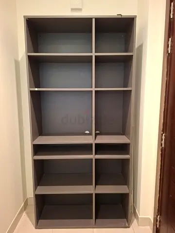 Tall grey bookshelf with 12 cubby shelves - sturdy storage unit