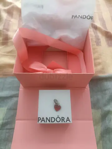 Pandora red heart enamel dangle charm in original pink box.