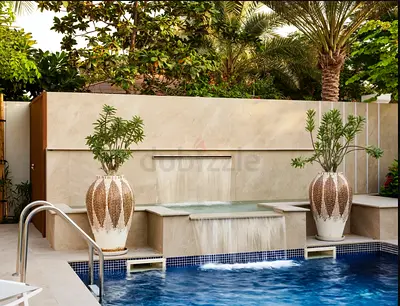 Outdoor stone water feature with three waterfall spouts — ready to install