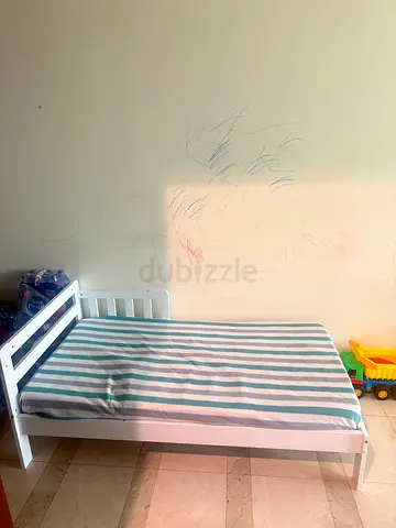 White toddler bed frame with mattress — good condition