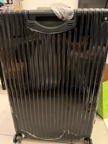 Large hard-shell roller suitcase with wheels - used - size 28