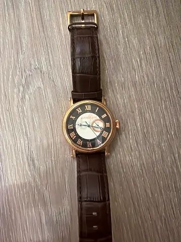Classic rose-gold men's wristwatch with brown leather strap