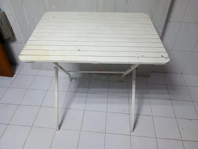 Foldable white outdoor/utility table, used - sturdy and compact