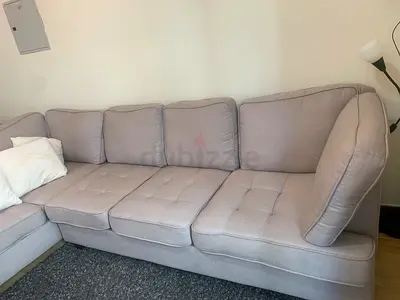 Light grey L-shaped fabric sofa — 7-seat with 5 pillows