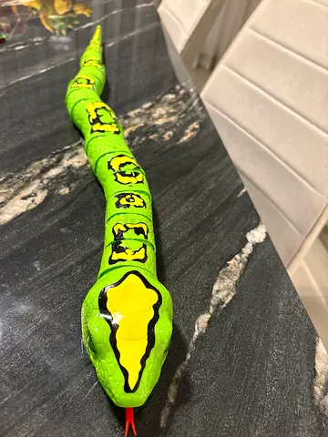 Long Flexible Green Toy Snake - Bendable Prank Prop and moving snake. It has battery
