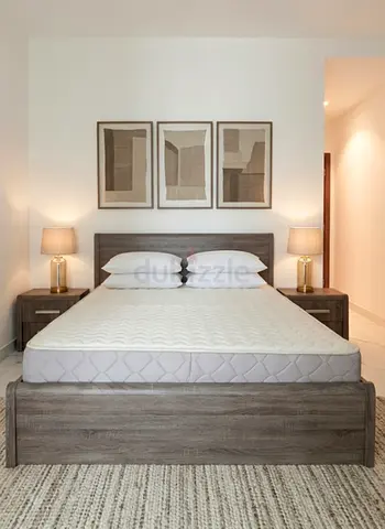 Queen wooden bed frame with mattress and bedside tables