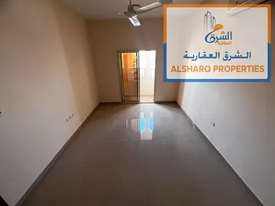 Balcony with an open view - Master bedroom - Spacious - Prime location near all amenities - Easy access to Sharjah and Dubai