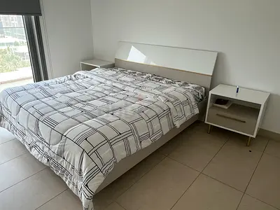 Modern white double bed frame with two matching bedside tables and a dressing table Home Centre