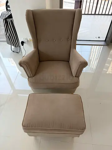 Beige Wingback Armchair with Ottoman - Good Condition