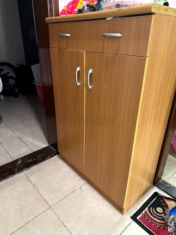 Compact two-door wooden cabinet with drawer - good condition