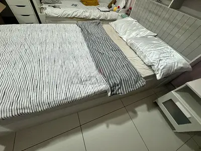 Queen bed frame with upholstered headboard and storage base - good condition