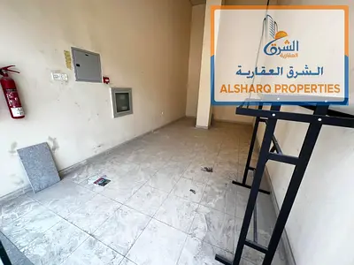 Shop for annual rent in Al Rashidiya 3, opposite Grand Mall, parking available in a prime location, spacious area