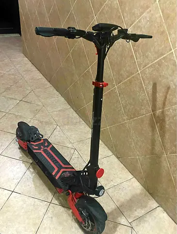 Used adult electric scooter - solid deck, front suspension, good condition, 2 months used only