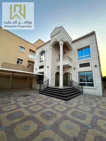 Villa for sale in Al Rawda 2, located in a prime residential area close to the exits of Sheikh Mohammed Bin Zayed Road, with easy access to Dubai Inte