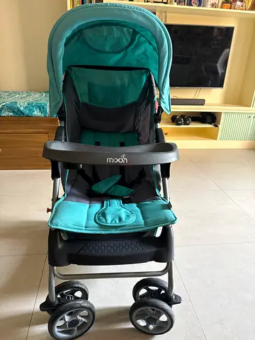 Lightweight teal baby stroller in good condition