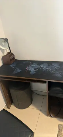 Compact study desk with world-map top and storage shelf