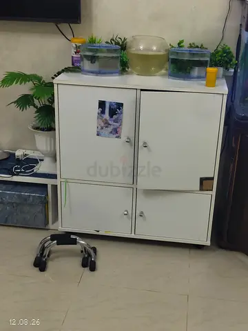 Compact white 4-door storage cabinet - good condition