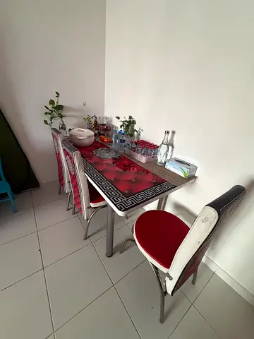 Glass Top Dining Table with 5 Red Padded Chairs - Compact Set
