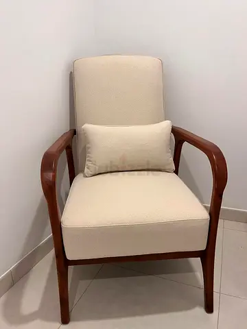 Two Mid-century style wooden lounge chair with cream upholstery