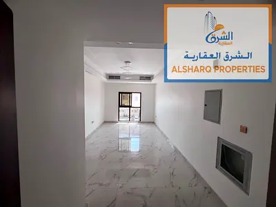 New two-bedroom apartment in Al Muwaihat 3, opposite Ajman Academy. Second occupancy. Features three bathrooms, master bedroom, balcony, and central a