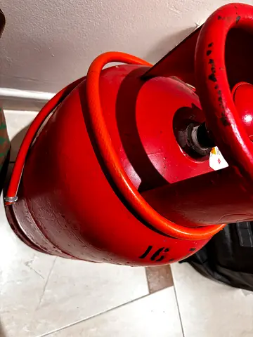 Partially Used Red LPG Gas Cylinder with Hose - Good Condition