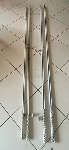 Metal curtain tracks/rails ( 2 sets) adjustable wall/ceiling mount is for sale.