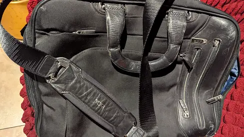 Black leather-look laptop briefcase with shoulder strap - used