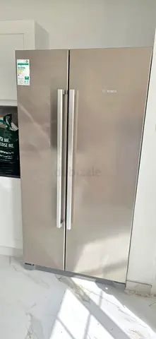 Bosch brand fridge side by side freezer digital neat and clean.