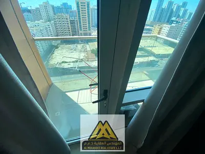 Two bedrooms and a large living room with a balcony in Ajman Industrial Area 2, behind Day to Day,