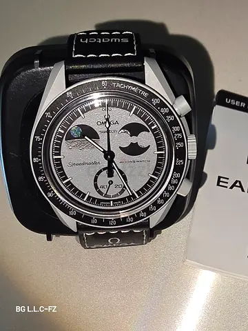 Omega x Swatch Moonswatch Mission to the Moonphase Snoopy Edition its original not copy