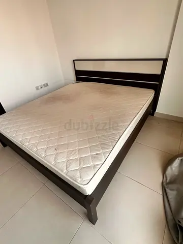 Used king bed frame with mattress - dark wood, good condition
