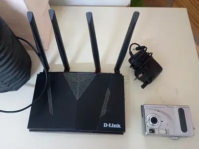 D-Link Wireless Router with 4 Antennas and Compact Digital Camera