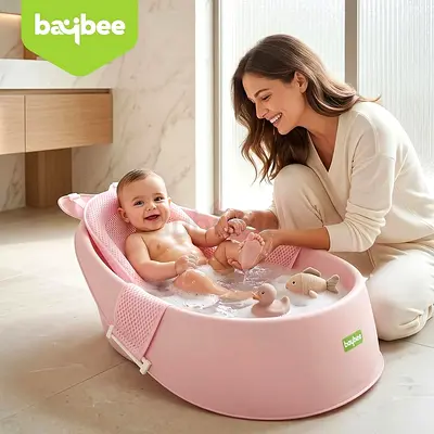 pink ergonomic baby bathtub with an anti-slip mesh bather sling