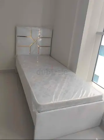 Single white bed with mattress and padded headboard - excellent condition