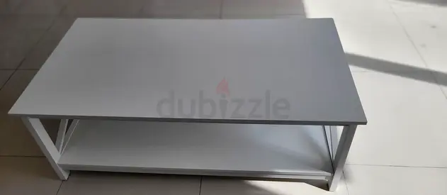 Simple white coffee table with lower shelf - good condition